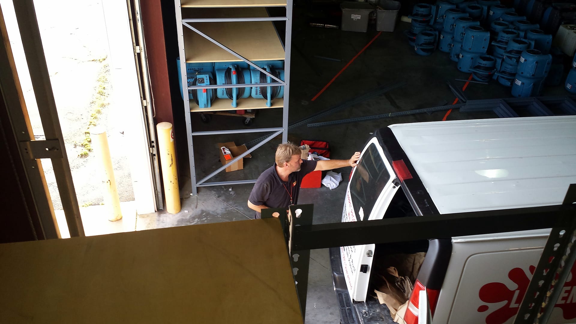Loading a truck-mounted unit at the shop