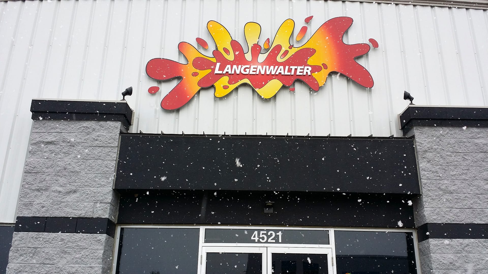 The Langenwalter sign at the Carmel shop in the snow